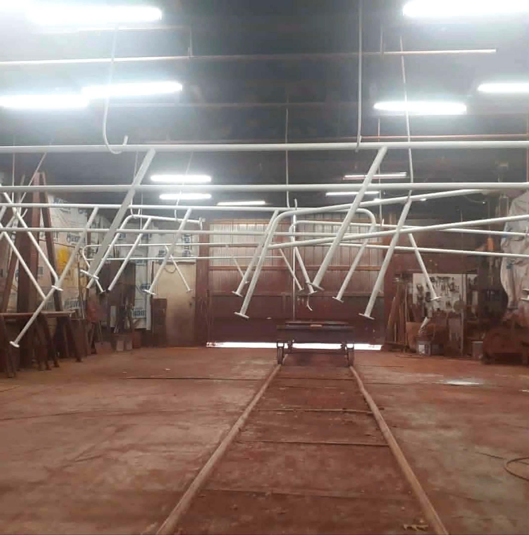 The same hand rail sections coated in clean white paint in the shop