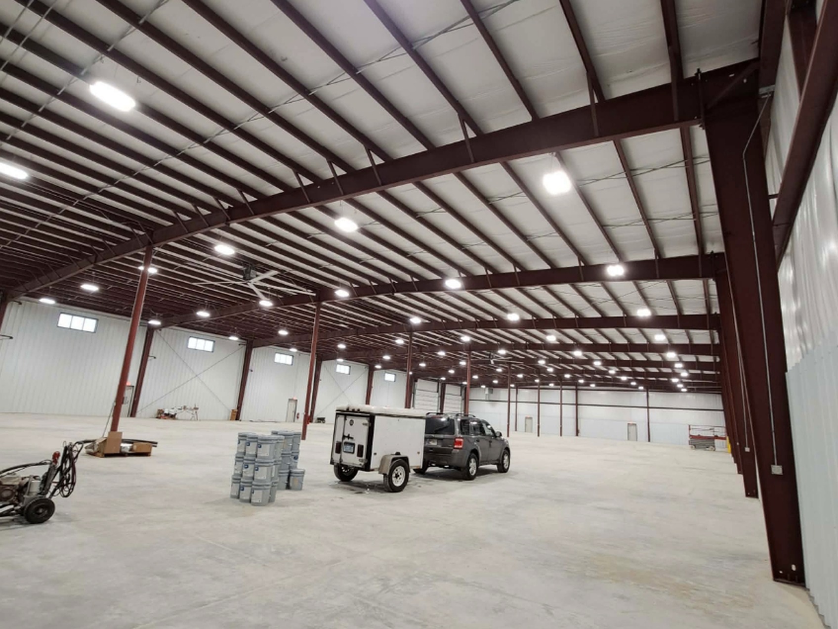 Large warehouse with dark brown structural steel before spraying