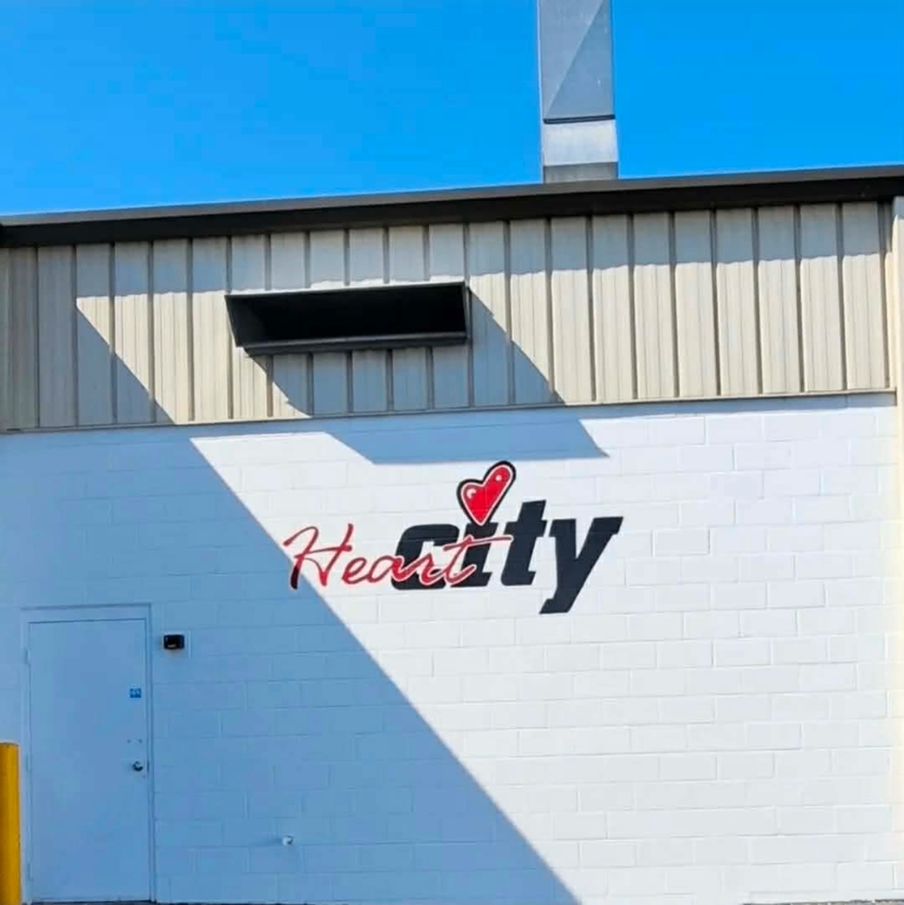 Heart City Toyota logo repainted in bold red and black